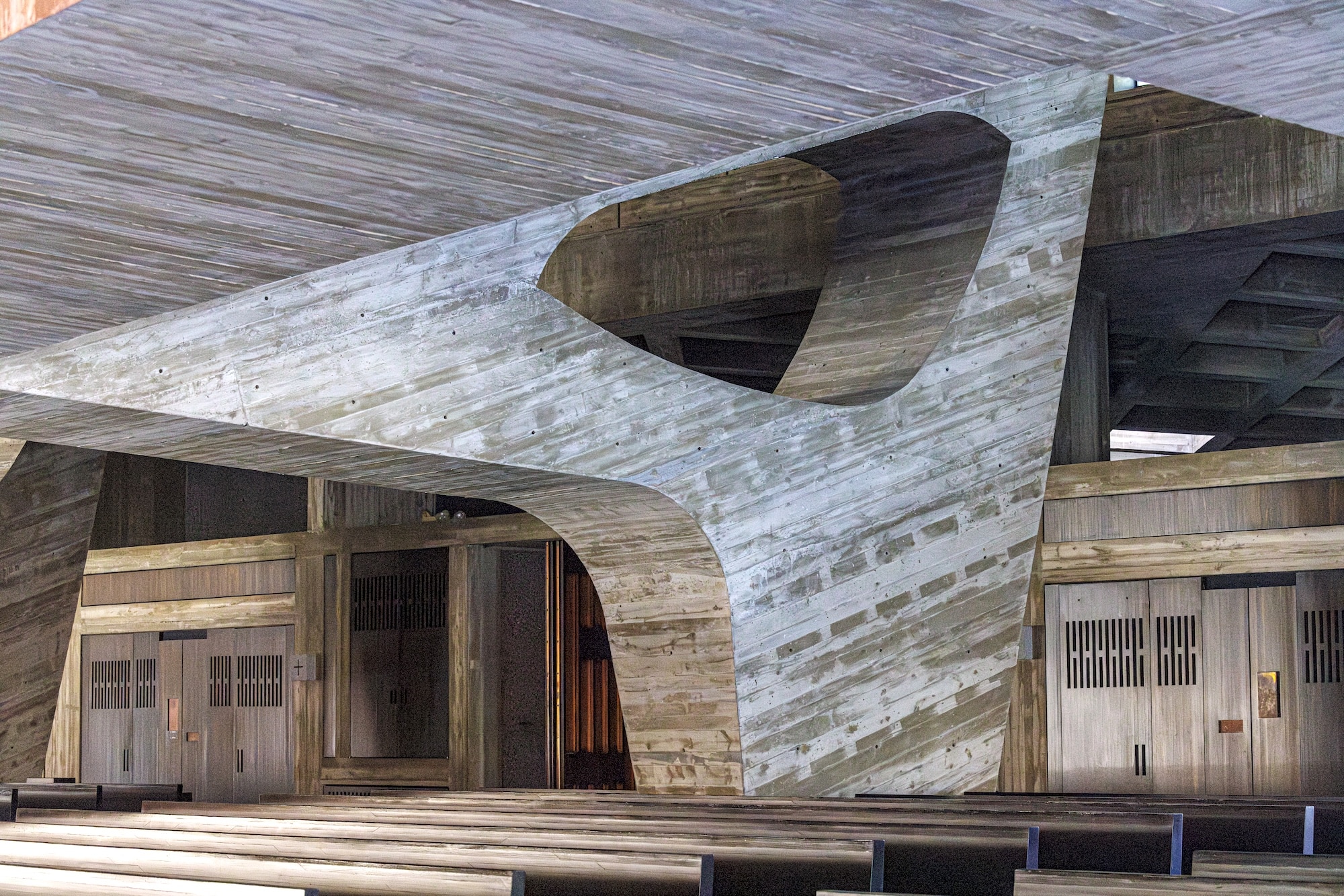 A close-up view of the sculptural concrete forms supporting the bell banner at Saint John's Abbey in Collegeville, Minnesota, on Feruary 18, 2025. On a snowy prairie in Minnesota stands a monastery like no other. For half a century, the existence of this masterpiece designed by modernist architect Marcel Breuer, has been mainly known to the Benedictine monks who worship there, and the hordes of architects who make pilgrimages to Saint John's Abbey Church each summer. But these days, it is finding new fame as the basis for "The Brutalist," the epic drama about an immigrant architect, haunted by the Holocaust, that is a favorite to win best picture at the Oscars. (Photo by Kerem YUCEL / AFP)