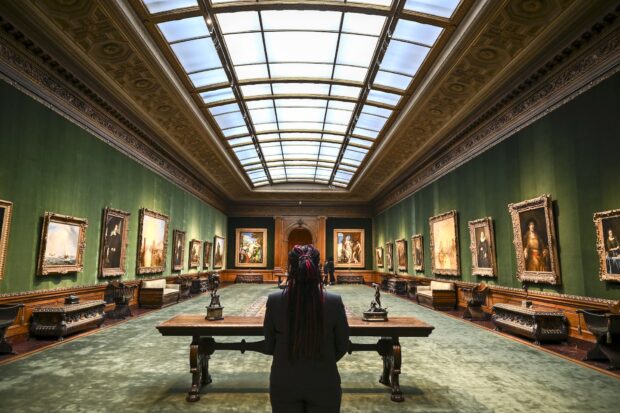 A person stands in the West Gallery during The Frick Collection press preview on March 25, 2025 in New York City. The Frick Collection reopens to the public on April 17, 2025, following the multi-year renovation and enhancement. (Photo by ANGELA WEISS / AFP) / RESTRICTED TO EDITORIAL USE - MANDATORY MENTION OF THE ARTIST UPON PUBLICATION - TO ILLUSTRATE THE EVENT AS SPECIFIED IN THE CAPTION