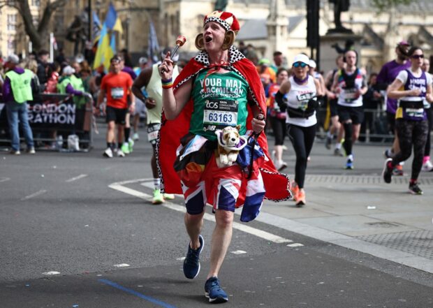Fun runners in fancy dress compete during the 2024 London Marathon in central London on April 21, 2024 | Photo by Henry Nicholls/AFP