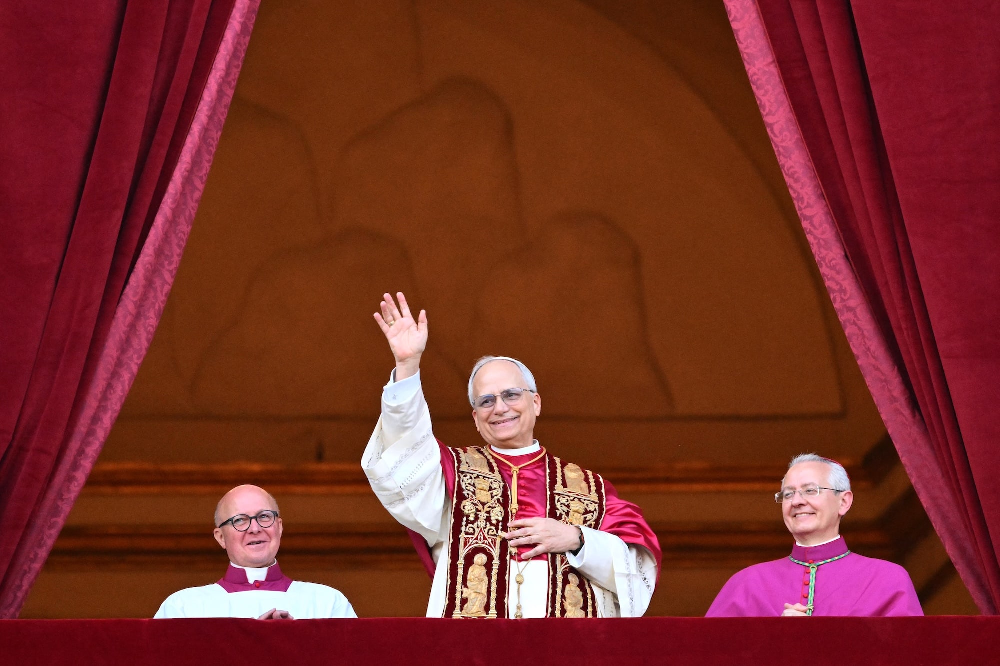 Newly elected Pope Leo XIV, Robert Prevost appears at the main central loggia balcony of the St Peter's Basilica for the first time, after the cardinals ended the conclave, in The Vatican, on May 8, 2025. Robert Francis Prevost was on Thursday elected the first pope from the United States, the Vatican announced. A moderate who was close to Pope Francis and spent years as a missionary in Peru, he becomes the Catholic Church's 267th pontiff, taking the papal name Leo XIV. (Photo by Alberto PIZZOLI / AFP)
