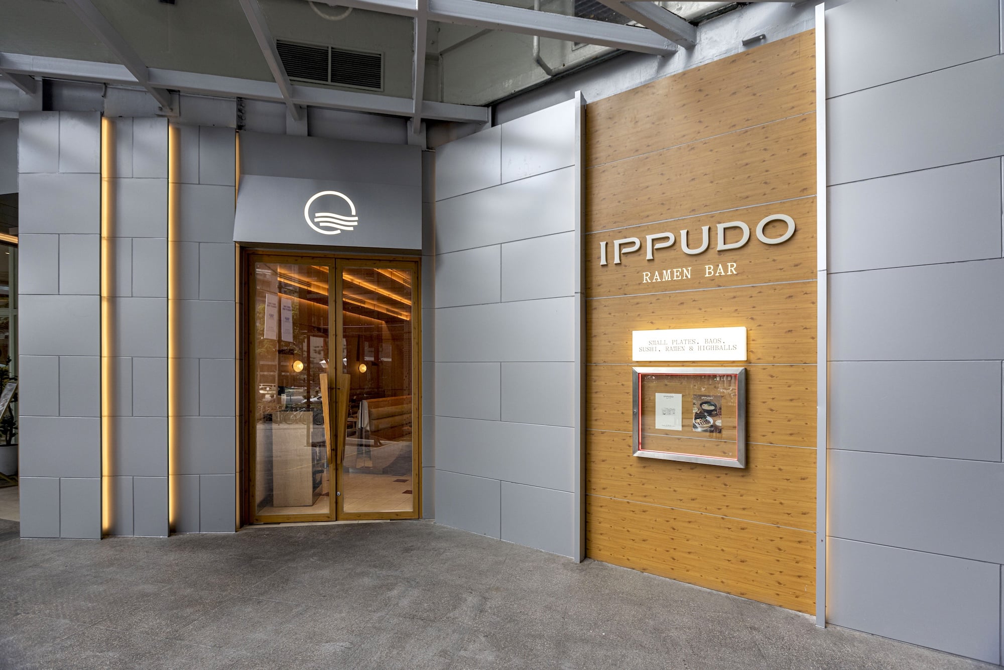 The Ippudo Ramen Bar facade lures you into a noticeably brighter space