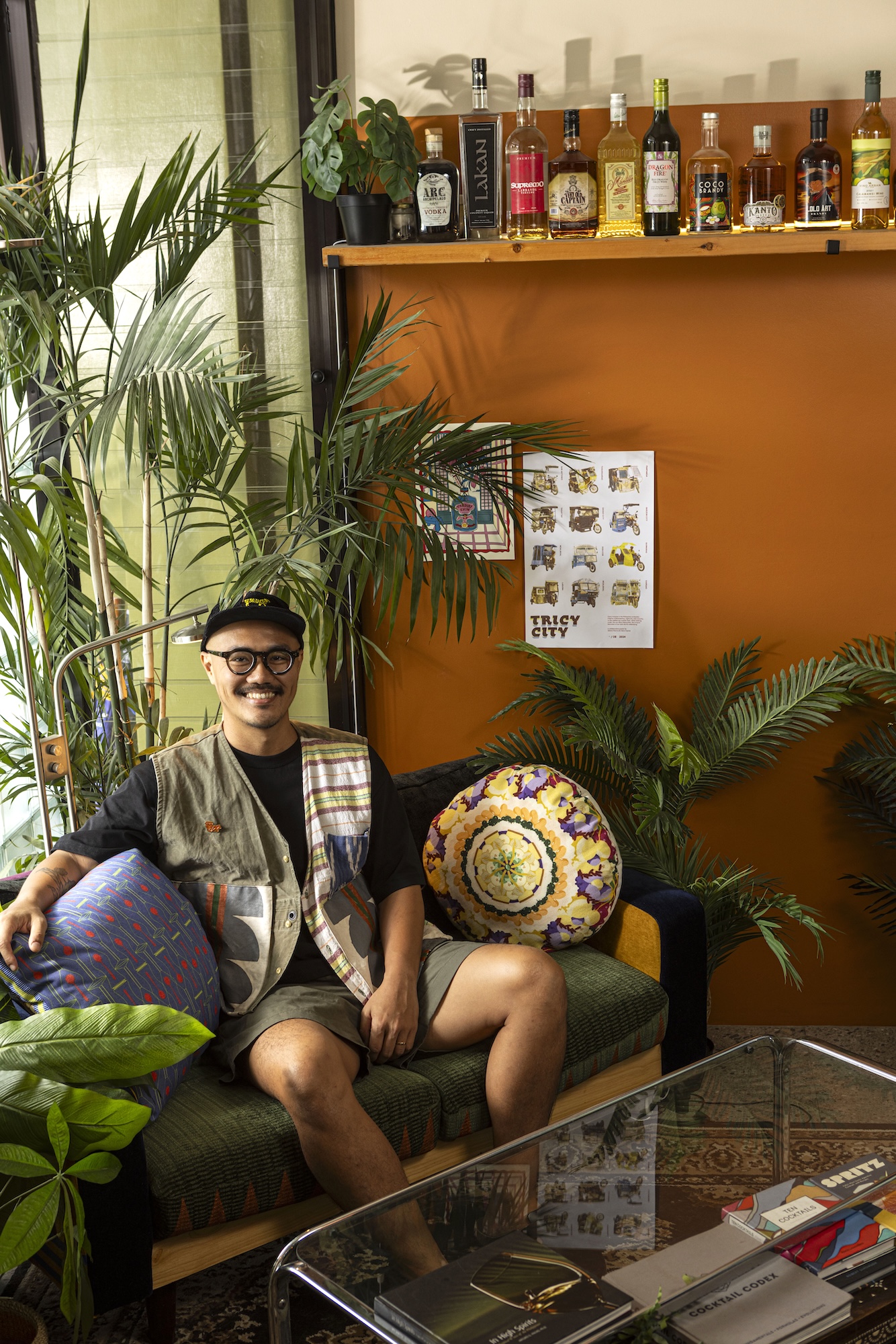 Ken Alonso sits on a corner of his Proudly Promdi house filled with furnishings and design details from Filipino talents