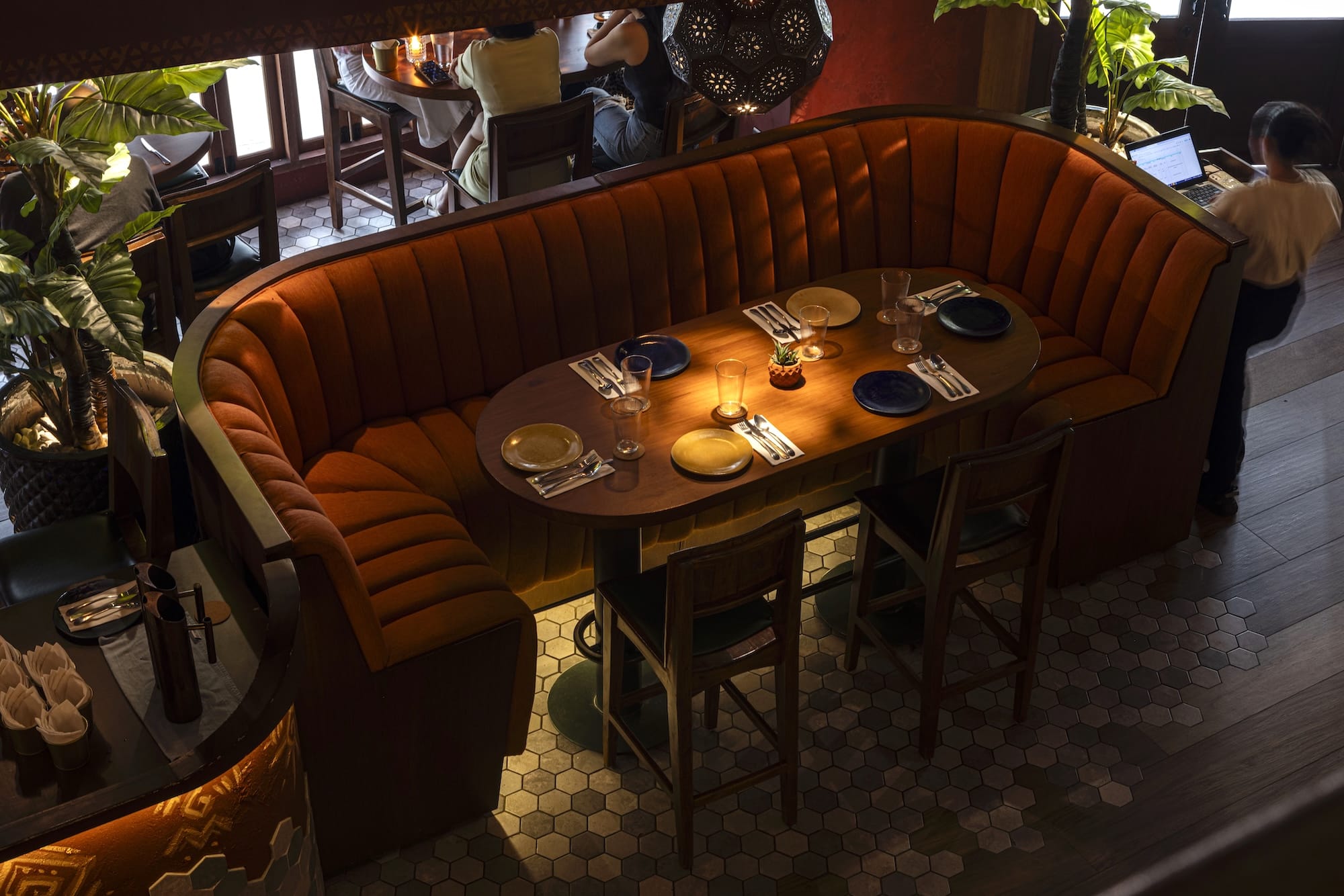 High stools and intimate lighting set the mood of the space
