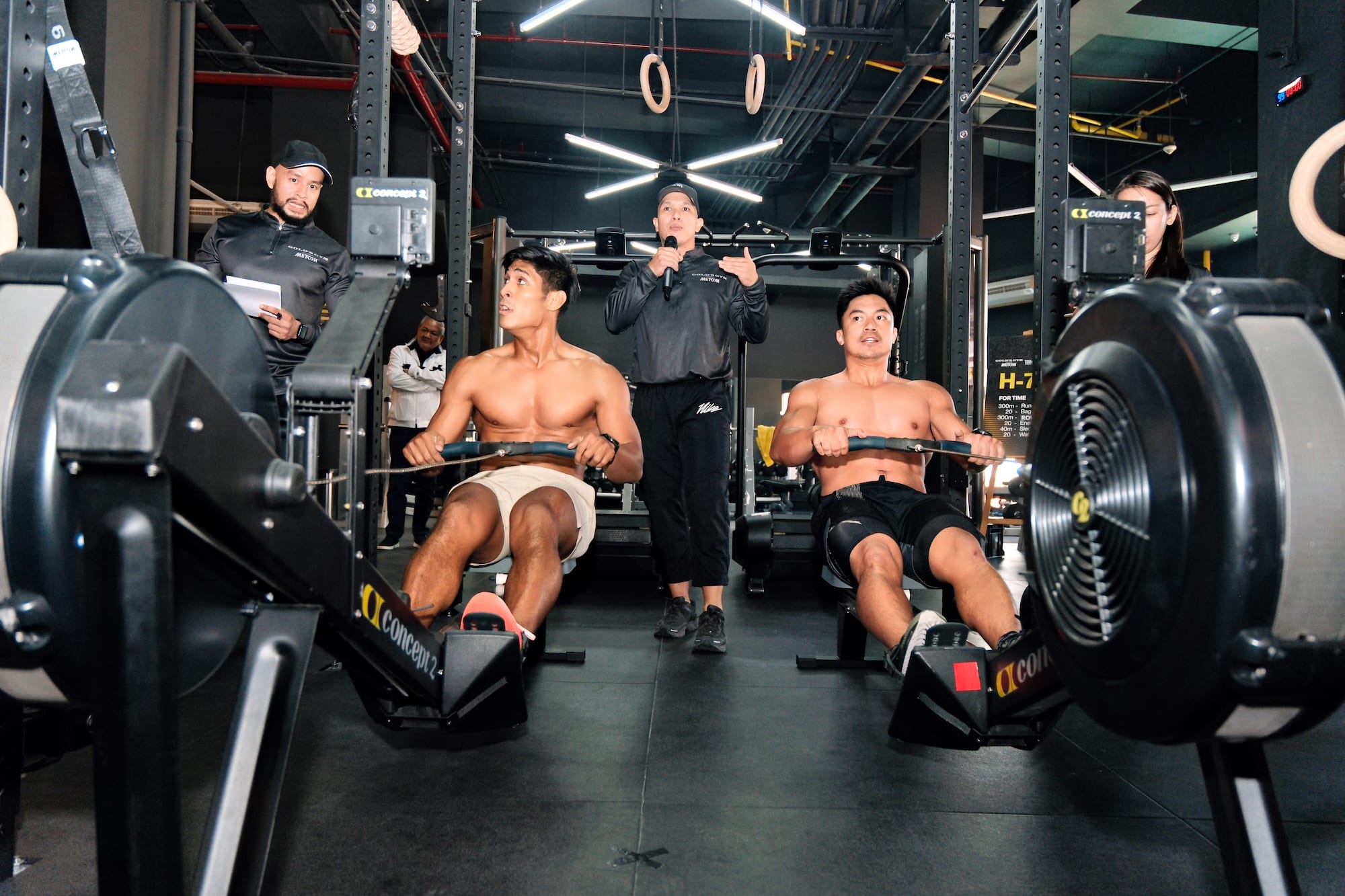 Grin Method coaches Tinoy Borromeo and Mauro Lumba do the 300m Ski Erg of the H-700 challenge